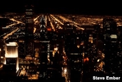 A clear night's view toward downtown Chicago from the top of the John Hancock Center. The tall buiding on the left is the Aon Center; to its right, Two Prudential Plaza.