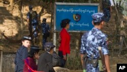 Myanmar police officers provide security at the border crossing in Taungpyo township, Maung Daw district, northern Rakhine State, Jan. 28, 2018. The military announced, June 26, 2018, that Major General Maung Maung Soe, the former head of the military's western command in Rakhine State, has been fired for his role in the brutal crackdown on Rohingya Muslims.