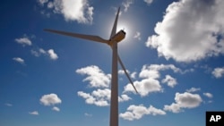 FILE - This wind turbine is one of several used to generate electricity near the small town of Darling, on the outskirts of Cape Town, South Africa. 