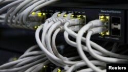 Ethernet cables used for internet connection are seen at the headquarters of the Wnet internet service provider in Kyiv, July 26, 2017.
