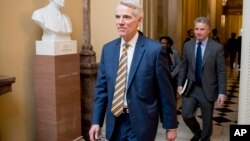 Sen. Rob Portman, R-Ohio, center, walks to a meeting with Republican Senate leadership at the offices of Senate Majority Leader Mitch McConnell of Ky. on Capitol Hill, Feb. 11, 2019, in Washington.
