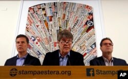 From left, Juan Carlos Cruz, James Hamilton and Jose Andres Murillo meet reporters at the foreign press association in Rome, May 2, 2018.