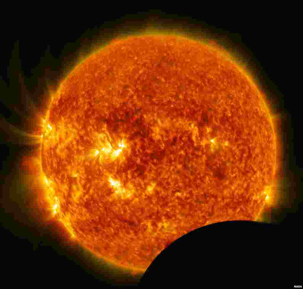 On July 26, 2014, from 10:57 a.m. to 11:42 a.m. EDT, the moon crosses between NASA&rsquo;s Solar Dynamics Observatory (SDO) and the sun, a phenomenon called a lunar transit. A lunar transit happens approximately twice a year, causing a partial solar eclipse that can only be seen from SDO. Images of the eclipse show a crisp lunar horizon, because the moon has no atmosphere that would distort light.