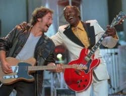 Bruce Springsteen and Chuck Berry during the performance of "Johnny B. Goode" at a concert for the Rock and Roll Hall of Fame in Cleveland, Ohio, in 1995