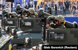 UKRAINE -- Ukrainian Army servicemen ride with Javelin anti-tank missiles during a military parade marking Ukraine's Independence Day in Kyiv, August 24, 2018