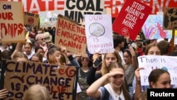 Students are seen attending a "Climate Strike" protest in Canberra, Australia, March 15, 2019. 