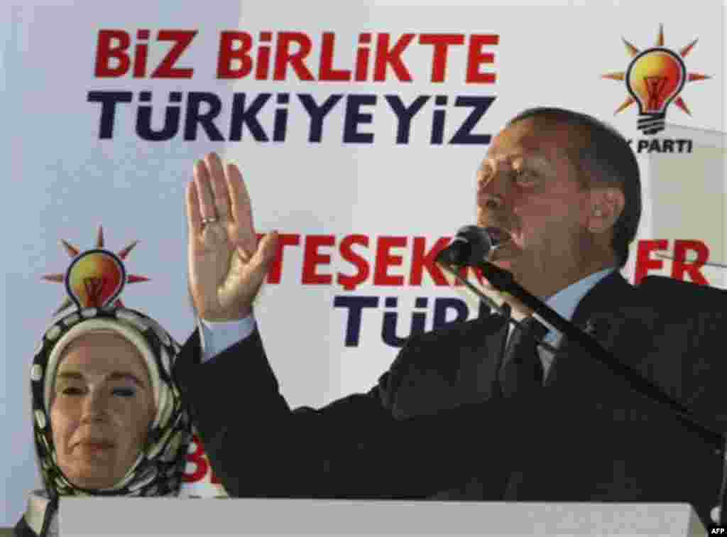 Turkish Prime Minister Recep Tayyip Erdogan addresses his supporters gathered in front of his Justice and Development Party headquarters in Ankara, Turkey, late Sunday, June 12, 2011. According to initial results Turkey's ruling party won a third term in