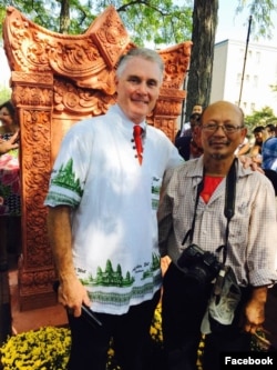 Rodney Elliott, a former city mayor and a city councilor of Lowell (left) and Mr. Yary Livan, a ceramist and a teacher at Middlesx Community College, attended the inauguration of Khmer Refugee Monument, at Lowell City Hall, Sept. 24, 2017.