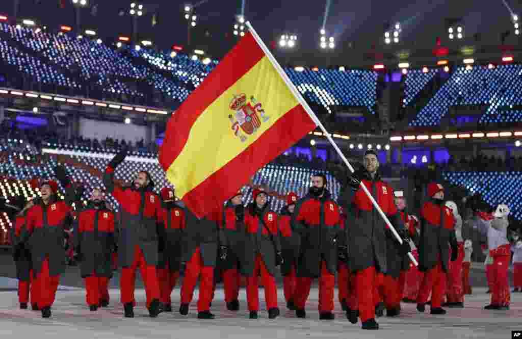 Lucas Eguibar carries the flag of Spain during the opening ceremony of the 2018 Winter Olympics in Pyeongchang, South Korea, Feb. 9, 2018.