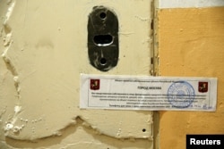 FILE - The office door of rights group Amnesty International is sealed off in Moscow, Russia, Nov. 2, 2016.