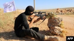 A rebel fighter from the "First Battalion" under the Free Syrian Army takes part in a military training on June 10, 2015, in the rebel-held countryside of the northern city of Aleppo. 