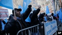 Uighurs and their supporters protest in front of the Permanent Mission of China to the United Nations in New York, March 15, 2018. 