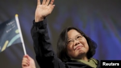 Democratic Progressive Party (DPP) Chairperson and presidential candidate Tsai Ing-wen waves to supporters as they celebrate her election victory at the party's headquarters in Taipei, Taiwan, Jan. 16, 2016. 