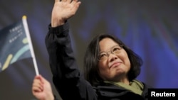 Democratic Progressive Party (DPP) Chairperson and presidential candidate Tsai Ing-wen waves to supporters as they celebrate her election victory at the party's headquarters in Taipei, Taiwan, Jan. 16, 2016. 