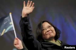 Democratic Progressive Party (DPP) Chairperson and presidential candidate Tsai Ing-wen waves to supporters as they celebrate her election victory at the party's headquarters in Taipei, Taiwan, Jan. 16, 2016.