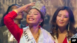Tenzin Paldon, 21, reacts after winning the 2017 Miss Tibet beauty pageant at the Tibetan Institute of Performing Arts in Dharmsala, India, June 4, 2017.