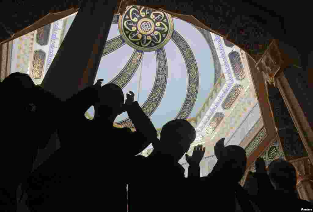 Muslims pray during a Friday prayer service at the Grand Mosque in Moscow, Russia.