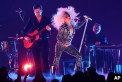 Lady Gaga, right, and Mark Ronson perform "Shallow" at the 61st annual Grammy Awards on Sunday, Feb. 10, 2019, in Los Angeles.