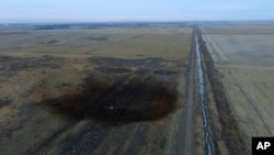 This aerial photo shows spills from TransCanada Corp.'s Keystone pipeline, Nov. 17, 2017, that leaked an estimated 210,000 gallons of oil onto agricultural land in northeastern South Dakota, near Amherst, South Dakota.