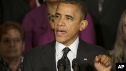 President Barack Obama gestures as he speaks about the economy and the deficit, Nov. 9, 2012, in the East Room of the White House in Washington. 