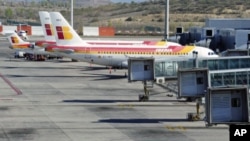 Planes of Spanish airline Iberia are parked at the Madrid's Barajas airport, at the start of a series of one-day strike by Iberia pilots, April 9, 2012.