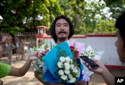 Ethnic Kachin activist Patrick Kum Ja Lee speaks to journalists outside Insein prison in Yangon, Myanmar, April 1, 2016.