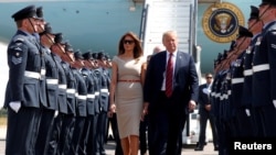 President Donald Trump and first lady Melania Trump arrive at Stansted Airport, Britain, July 12 2018.