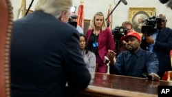 FILE - Rapper Kanye West speaks during a meeting in the Oval Office of the White House with President Donald Trump, in Washington, Oct. 11, 2018. It’s one of Trump’s favorite talking points in touting his administration’s success: The record low rate of black unemployment. 