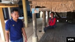 Migrant workers Min Sarun and Neang Chantrea are worried about repaying their loan after returning to Cambodia to no jobs, as they remained isolated in Bati district, Takeo province, Cambodia, April 7, 2020. (Ananth Baliga/VOA Khmer)
