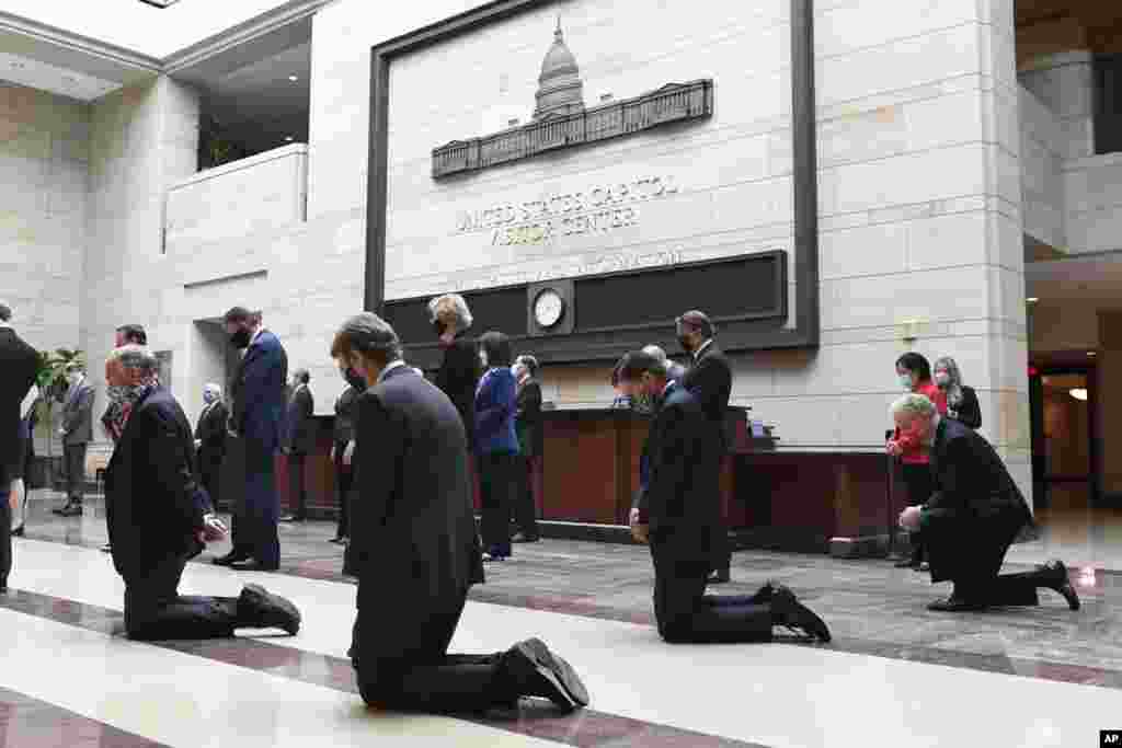 Democratic Senators pause for 8 minutes and 46 seconds on Capitol Hill in Washington, Thursday, June 4, 2020, to remember the life of George Floyd, a black man who died after being restrained by Minneapolis police officers. (AP Photo/Susan Walsh)