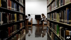 In this Friday, Oct. 19, 2012 file photo, students study in a library on the campus of California State University, Long Beach in Long Beach, Calif. (AP Photo/Jae C. Hong, File)