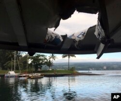 This photo provided by the Hawaii Department of Land and Natural Resources shows damage to the roof of a tour boat after an explosion sent lava flying through the roof off the Big Island of Hawaii, July 16, 2018.