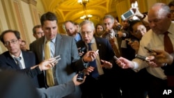 Senate Majority Leader Sen. Harry Reid, D-Nev., is surrounded by reporters after leaving the office of Senate Minority Leader Sen. Mitch McConnell, R-Ken., on Capitol Hill on Oct. 14, 2013.