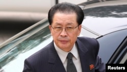 FILE - Jang Song Thaek, Chief of the Central Administrative Department of the Workers' Party of Korea, exits car as he arrives at the Ziguangge building of Zhongnanhai, the central government compound, in Beijing, Aug. 17, 2012.