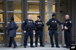 The Department of Homeland Security has personnel in place in front of the Brooklyn Federal Courthouse for the start of jury selection in the trial of Joaquin "El Chapo" Guzman, Nov. 5, 2018, in New York.