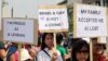 FILE - Indonesian gay activists hold posters during a protest demanding equality for LGBT (Lesbian, gay, bisexual and transgender) people in Jakarta, Indonesia, May 21, 2011.