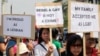 FILE - Indonesian gay activists hold posters during a protest demanding equality for LGBT (Lesbian, gay, bisexual and transgender) people in Jakarta, Indonesia, May 21, 2011.