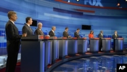 Republican presidential candidates from left, former New Mexico Governor Gary Johnson, former Pennsylvania Senator Rick Santorum, former House Speaker Newt Gingrich, Rep. Ron Paul, Texas Gov. Rick Perry, former Massachusetts Governor Mitt Romney, Rep. Mic