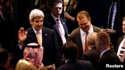 U.S. Secretary of State John Kerry waves toward Saudi Arabia's Foreign Minister Adel al-Jubeir, left, and Jordan's Foreign Minister Nasser Judeh after a round of Syria talks in Lausanne, Switzerland, Oct. 15, 2016. Before leaving Switzerland, Kerry said two American citizens who had been held by Houthi rebel militias in Yemen had been freed.