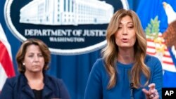 FILE - Anne Milgram, administrator of the Drug Enforcement Administration, right, speaks accompanied by Deputy Attorney General Lisa Monaco, during a news conference at the Department of Justice, Sept. 30, 2021, in Washington.