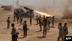 Yemeni soldiers stand near a rocket launching during a major offensive against al-Qaida in the Arabian Peninsula (AQAP) in the Maifaa region of Shabwa province, May 4, 2014. 