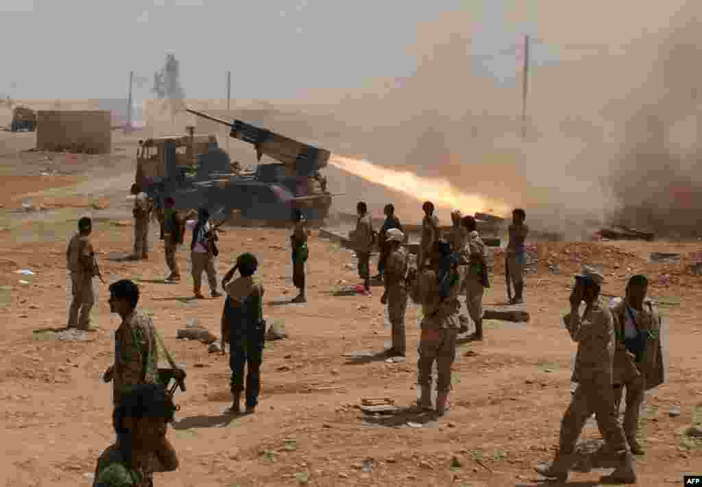 Yemeni soldiers stand near a rocket launching during a major offensive against al-Qaida in the Arabian Peninsula (AQAP) in the Maifaa region of Shabwa province.