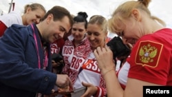 Russia's Prime Minister Dmitry Medvedev meets with members of the Russian Olympic team in London this summer. He recently called for a ban on smoking.