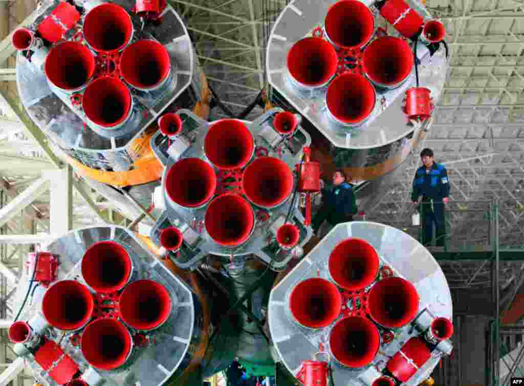 April 1: Preparations for launching Russian Soyuz TMA-21 spaceship that will carry a new crew to the international space station, are under way in an assembly shop at the Baikonur cosmodrome, Kazakhstan. (AP Photo/Dmitry Lovetsky)
