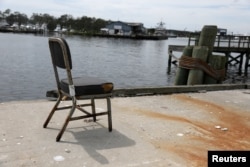 An empty chair sits at a dock in Wanchese, North Carolina, May 30, 2017.