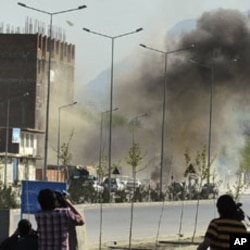 Smoke rises from the site of an attack near the Afghan parliament in Kabul, April 15, 2012.