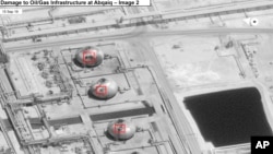 This image provided on Sunday, Sept. 15, 2019, by the U.S. government and DigitalGlobe and annotated by the source, shows damage to the infrastructure at Saudi Aramco's Abaqaiq oil processing facility in Buqyaq, Saudi Arabia.
