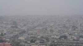 Smoke from wildfires and fog obscure the view of the ocean from Grand View Park in San Francisco, Monday, Sept. 14, 2020. (AP Photo/Jeff Chiu)