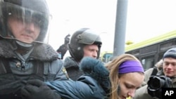 Police detain a protester in Moscow, February 12, 2011