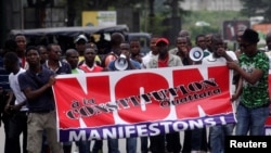 Members and supporters of the Ivorian Popular Front (FPI) party protest against President Alassane Ouattara's new constitution, in Abidjan, Ivory Coast, Oct. 8, 2016. The banner reads, "No to Ouattara constitution." 